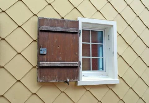 Single window with rustic shutter Stock Photos