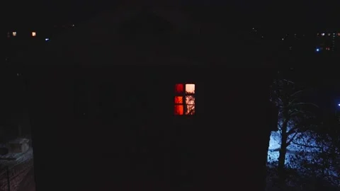 A single window shines in a two-story building. Vídeos de archivo 231803251