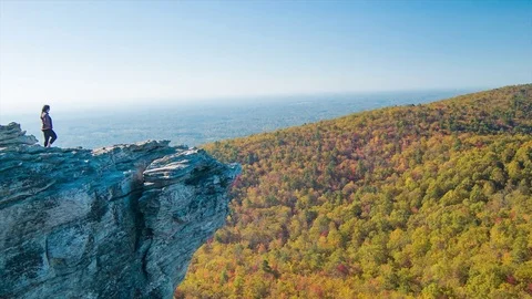 Single Woman at Dramatic Hanging Rock Overlook Stock Footage 70368888