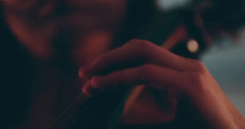 Single woman playing the cello, close-up and medium Stock Footage 240124304