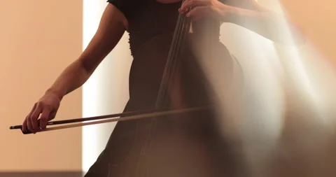 Single woman playing the cello, close-up and medium Stock Footage 240124416