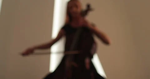 Single woman playing the cello, close-up and medium Stock Footage 240125853