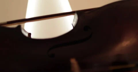Single woman playing the cello, close-up and medium Stock Footage 240125948