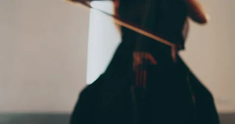 Single woman playing the cello, close-up and medium Stock Footage 240127668