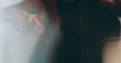 Single woman playing the cello, close-up and medium Stock Footage 240129304