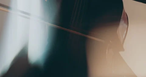 Single woman playing the cello, close-up and medium Stock Footage 240129322