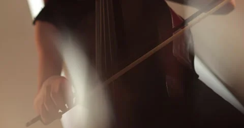 Single woman playing the cello, close-up and medium Stock Footage 240129477