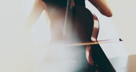 Single woman playing the cello, close-up and medium Stock Footage 240130727