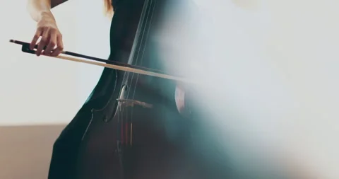 Single woman playing the cello, close-up and medium Stock Footage 240131478