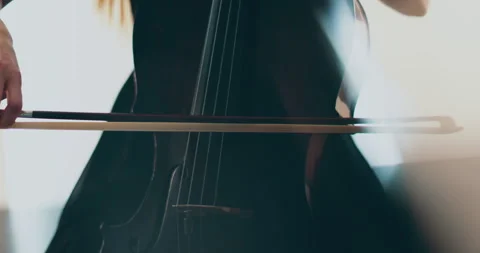 Single woman playing the cello, close-up and medium Stock Footage 240131805