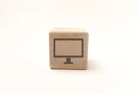 Single wooden block cube featuring a gray computer monitor icon on natural .. Stock Photos