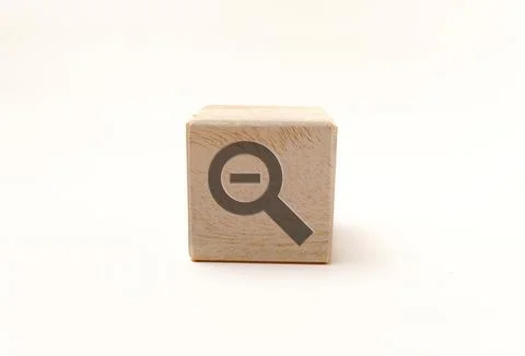 Single wooden block cube featuring a gray zoom out magnifying glass icon on.. Stock Photos