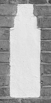 Single Worn Plaster Inlay in Brick Wall Stock-Fotos