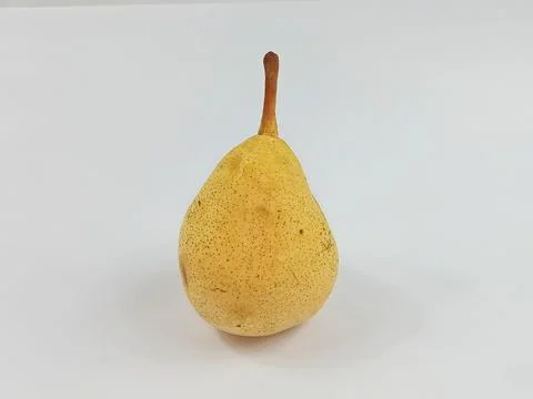 Single Yellow Pear on White Background Stock Photos