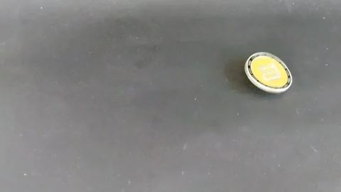 A single yellow pill on a dark surface. Stock Footage 335464777