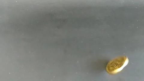 A single yellow pill on a dark surface. Stock Footage 335464779