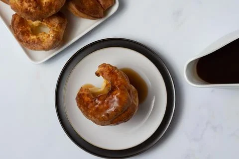 Single Yorkshire Pudding  top view covered in gravy Stock Photos