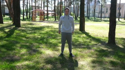 Single young man doing exercises in the forest park, street workout. Fitness Stock Footage 153531861