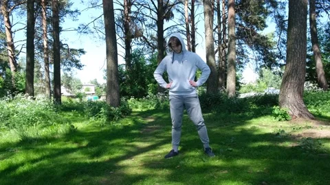 Single young man doing exercises in the forest park, street workout. Fitness Stock Footage 153640043