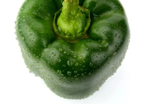 Single,one green pepper close-up view from top with tail isolated on white ba Stock Photos