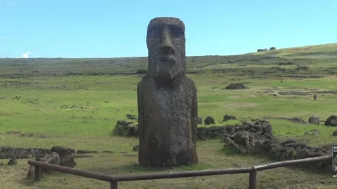 Singular Ancient maoi statue in landscape with mountain and feilds Stock Footage 162813556