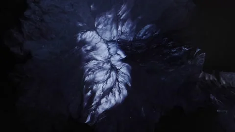 Sinister black implodes and flows into itself, like this is dark stuff-  Stockbeeldmateriaal 157575373