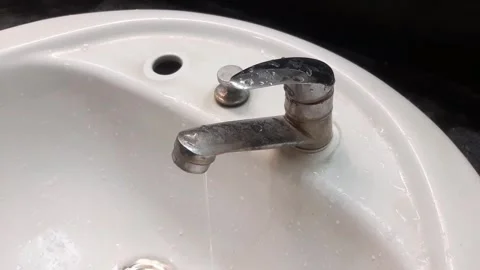 Sink faucet that keeps dripping, broken faucet leaking Stock Footage 284442902