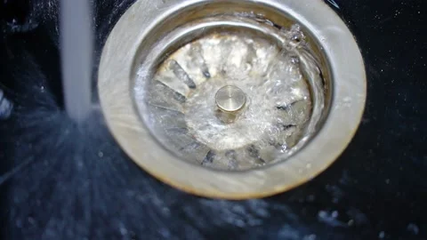 Sink in the kitchen. Concept: saving runing water Stock Footage 235676530