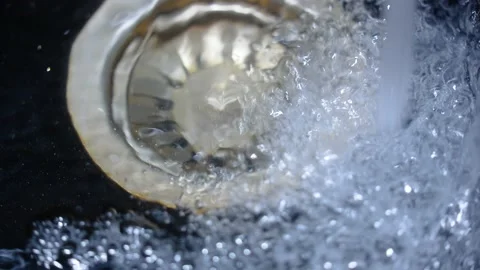 Sink in the kitchen. Concept: saving runing water Stock Footage 235678202