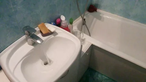 Sink waterfall in bathroom Stock Footage 97602547