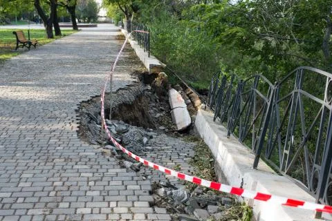 A sinkhole on a footpath in the Park Stock Photos