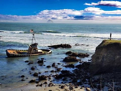 A sinking ship in the ocean Stock Photos