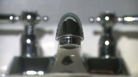Sinks faucet ejecting water. (v.2) Stock Footage 1103586