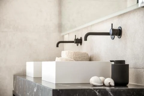 Sinks on marble table in bathroom Stock Photos