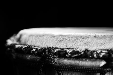Sinlge West African Drum in Dramatic Single Light in Black and White. Stock Photos