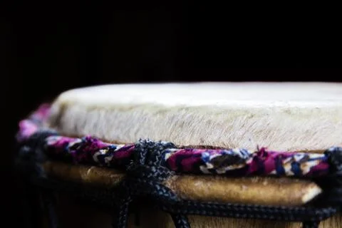 Sinlge West African Drum in Dramatic Single Light: Side Look. Stock Photos