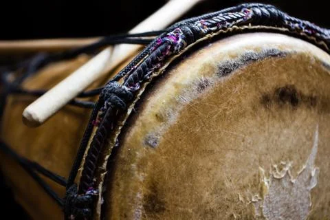 Sinlge West African Drum in Dramatic Single Light. Side View. Stock Photos