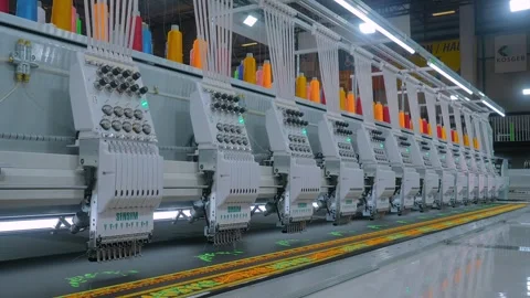 Sinsim embroidery machine is creating decorative textile pattern on the fabric Stock Footage 344332860