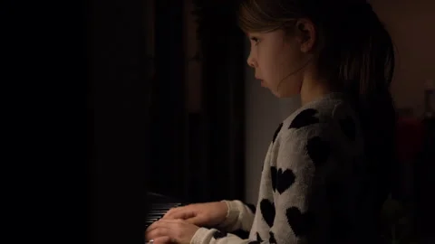 Sinterklaas liedje Stoomboot, girl plays piano Closeup, 4K Stock Footage