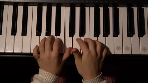 Sinterklaas liedje Stoomboot, girl plays piano hands Top shot, 4K Stock Footage
