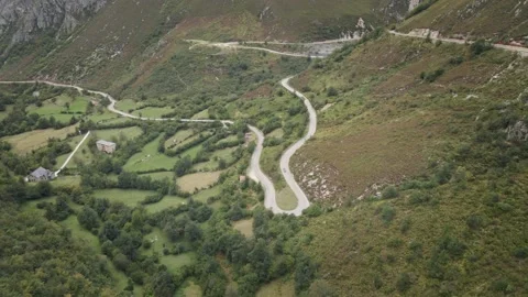 Sinuous a Dangerous High Mountain Road between Rocks and Trees. Asturias, Spain. Stock Footage 140861573