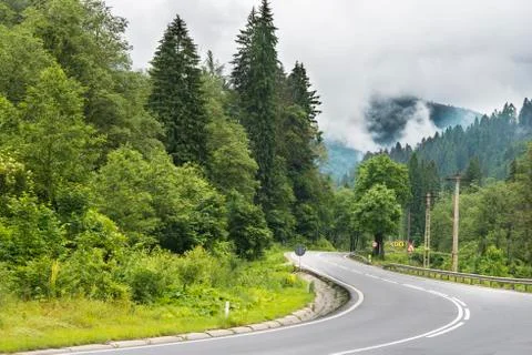 Sinuous road in mountains Stock Photos