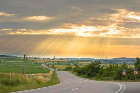 Sinuous road in summer day Stock Photos