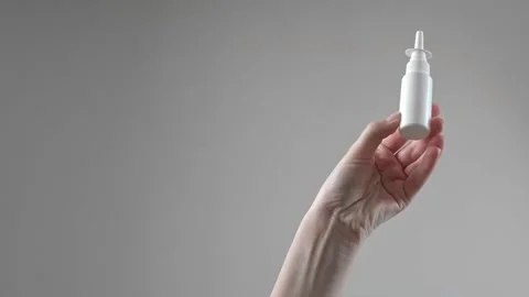 Sinusitis medication for treating sinus inflammation, woman using nasal drops, n Stock Footage 285624767