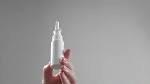 Sinusitis medication for treating sinus inflammation, woman using nasal drops, n Stock Footage 285624769