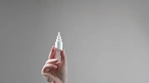 Sinusitis medication for treating sinus inflammation, woman using nasal drops, n Stock Footage 285624781
