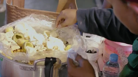 Siomay seller is preparing customer order, siomay is a traditional snack fr.. Stock Footage 326302904