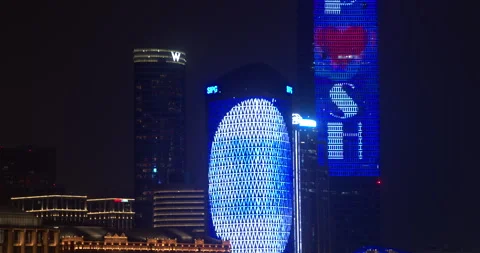 SIPG Tower and Sinar Mas Plaza LED light show at night in SHANGHAI CHINA Stock Footage 344915938