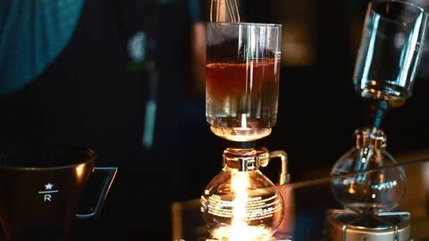 Siphon coffee being stirred Stock Footage 81343043