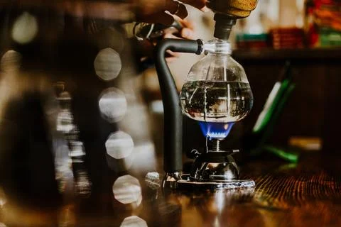 Siphon vacuum coffee maker on cafe bar Stock Photos